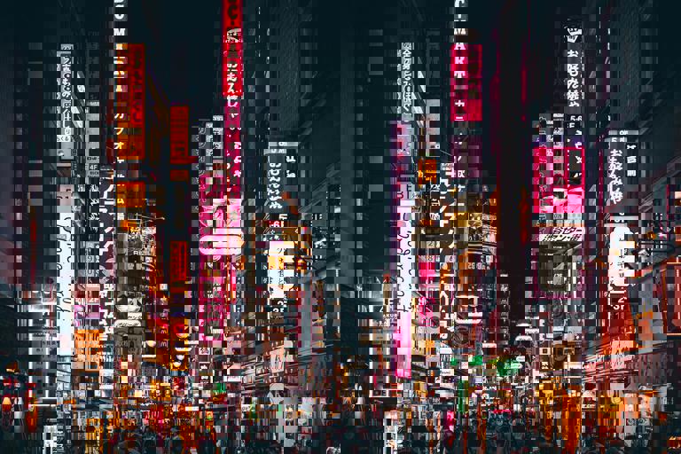 Last Standing Neon Sign Sparks Nostalgia Among City’s Nighttime Crowd